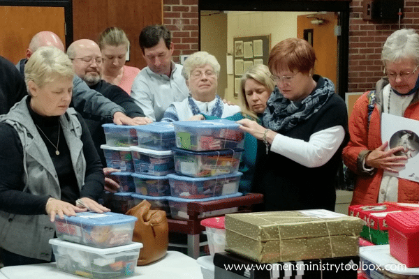 Praying over Operation Christmas Child Shoeboxes